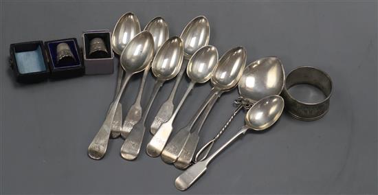 Assorted silver spoons, two thimbles and a serviette ring.